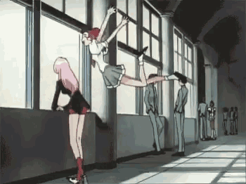 a girl is jumping in the air while another girl looks out a window in a hallway .
