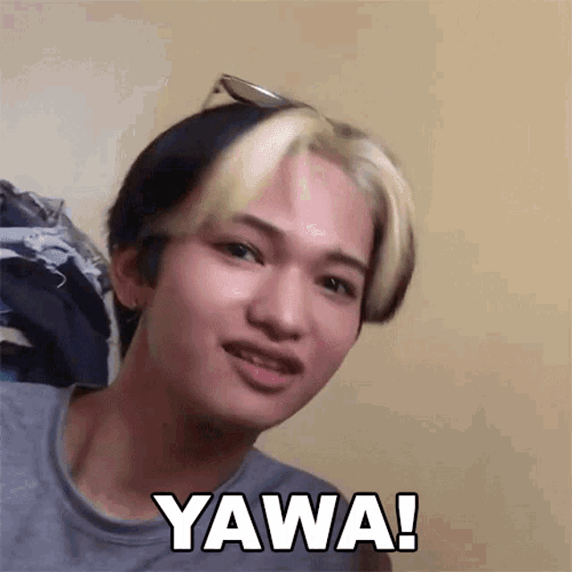 a young man wearing sunglasses is making a funny face and says ' wawa '