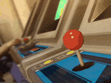 an arcade machine has a red button that says ' a ' on it