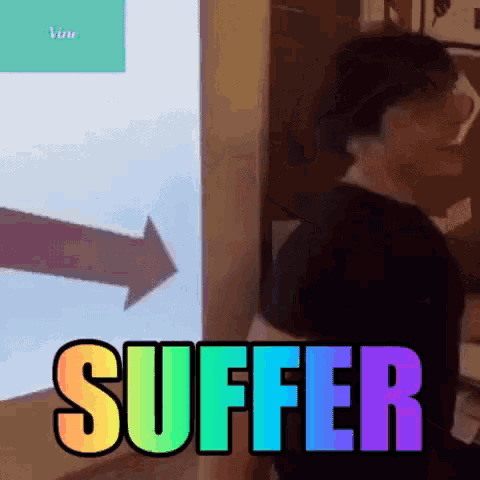 a man is standing in front of a screen with the word suffer on it