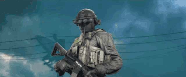a soldier with a helmet on holds a gun in front of a cloudy sky