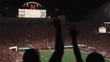 a football game is being played in a stadium that says memorial stadium