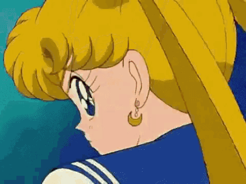 a close up of a person wearing a sailor suit and earrings .