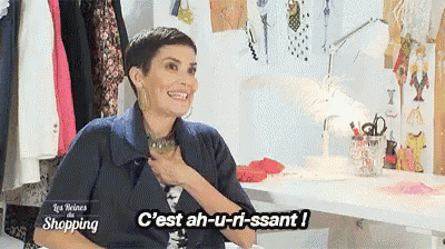a woman sitting at a table with the words c'est ah-u-ri-ssant written on the bottom