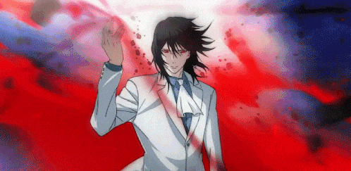a man in a white suit and tie is standing in front of a red background .