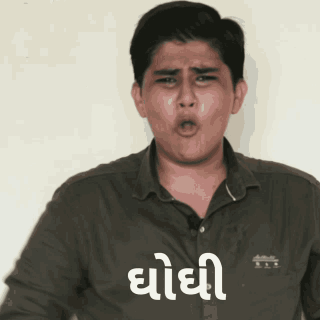 a man making a funny face with a sticker that says ' chodhi ' on it