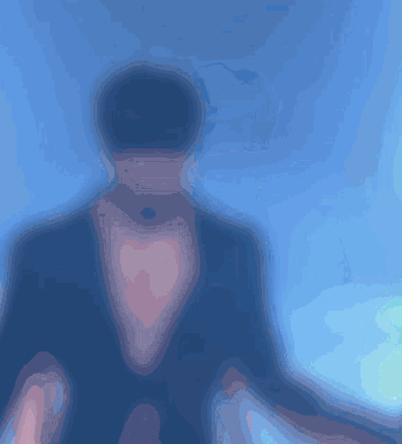 a blue background with a silhouette of a man in a suit