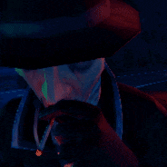 a man wearing a hat is smoking a cigarette