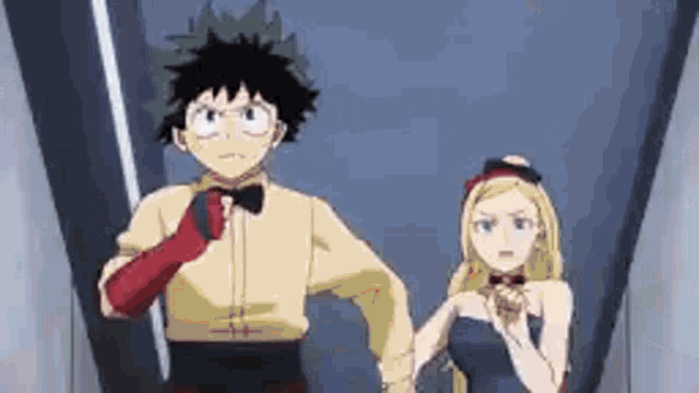 a man and a woman are holding hands in a hallway .