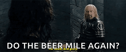 a man in a knight 's armor is asking a woman do the beer mile again