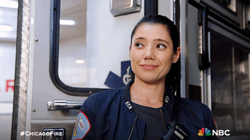 a woman is leaning against an ambulance with the hashtag #chicagofire