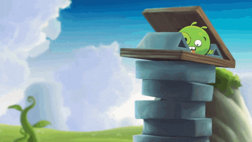 a green cartoon character is sitting on top of a stone tower