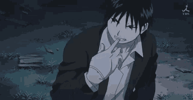 a man in a suit and white gloves is being held by another man .