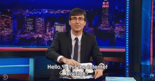 a man in a suit and tie is talking on a phone with the words " hello is this the internet division "