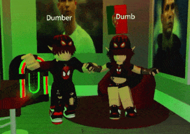 dumb and dumber are standing next to each other in front of a jukebox