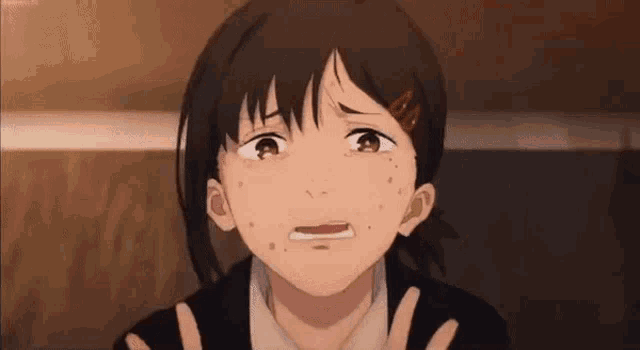 a close up of a person 's face with a tear running down her face .