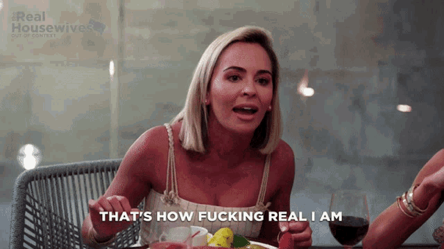 a woman says that 's how fucking real i am in front of a real housewives logo
