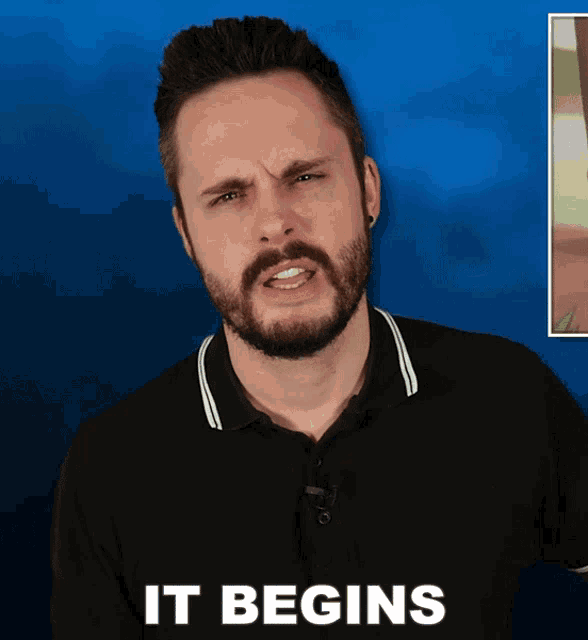 a man with a beard stands in front of a blue background with the words it begins below him