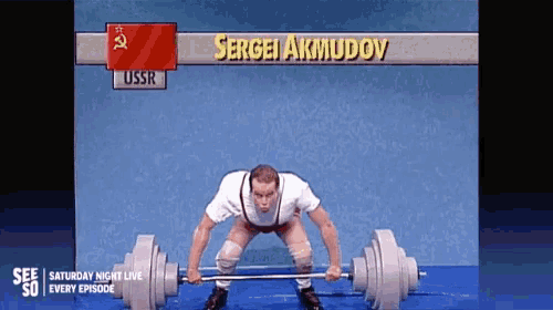 a man is lifting a barbell with the name sergei akmudov on the bottom