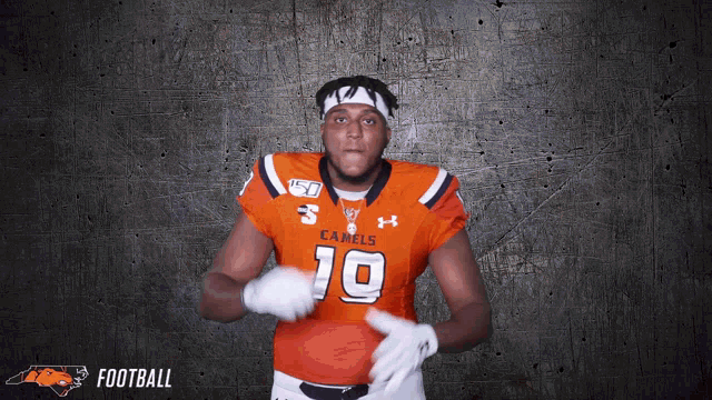 a football player wearing a jersey that says camels on it