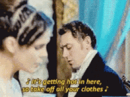 a man and a woman are talking and the man is saying it 's getting hot in here so take off all your clothes