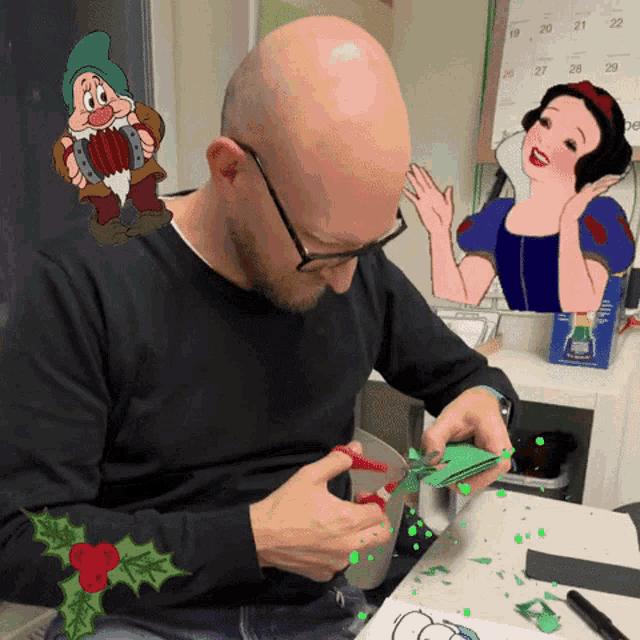 a man is cutting a piece of paper in front of a snow white cartoon