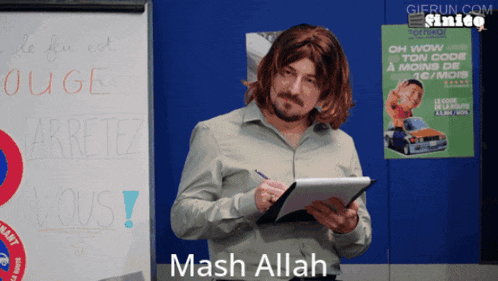 a man holding a clipboard says mash allah in front of a white board