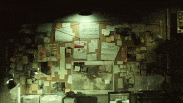 a bulletin board with a lot of sticky notes on it
