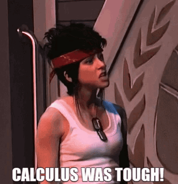 a woman wearing a red bandana and a white tank top is standing next to a wall and says calculus was tough !
