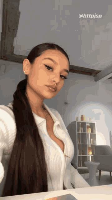 a woman is taking a selfie in a room with the hashtag httpsjsp