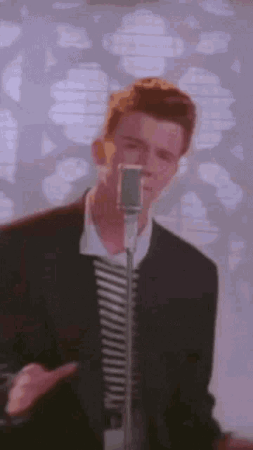 Rick Astley Never Gonna Give You Up GIF - Rick Astley Never Gonna Give You Up Cry For Help GIFs