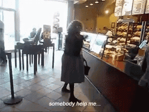 a woman standing in front of a counter in a bakery with the words somebody help me below her
