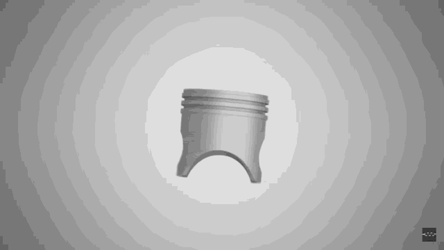 a 3d model of a piston on a gray background with the letters t and r on it