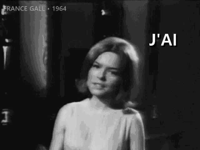 a black and white photo of a woman with the words j ' ai on the bottom .