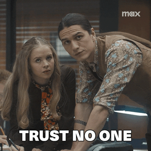 a man and a woman are standing next to each other with the words trust no one written on the bottom