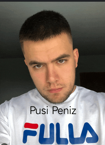 a man is wearing a fulla t-shirt and looking at the camera