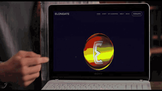 a person pointing at a sony laptop that says elongate