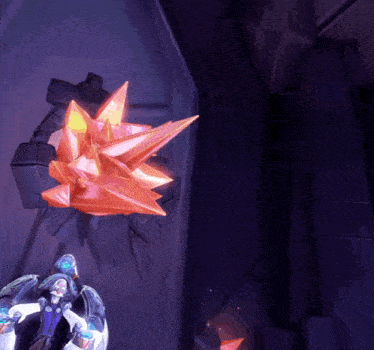 a video game character is standing in front of a large orange object