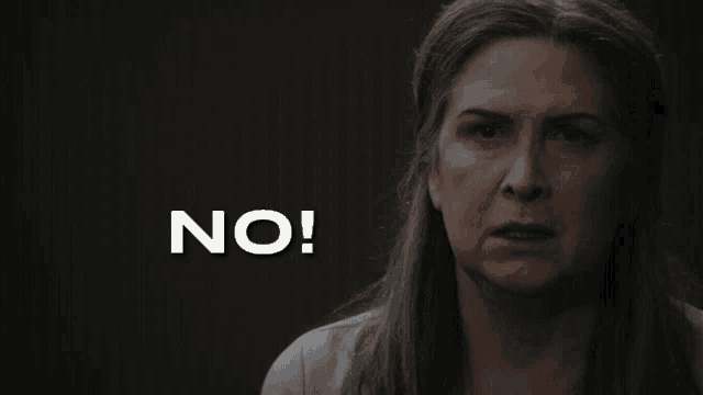 a woman with gray hair is making a face and says no