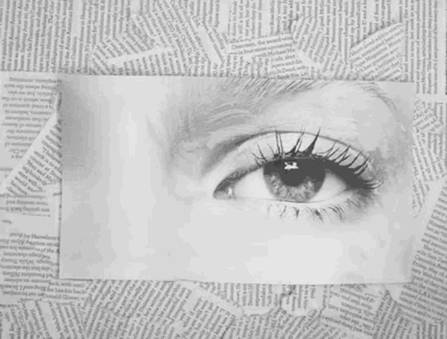 a black and white photo of a woman 's eye with the words get o cut out
