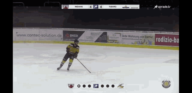 a hockey game is being played between the indians and the tuborg