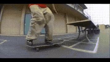 a skateboarder is doing a trick on a concrete surface