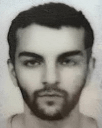 a black and white photo of a man with a beard