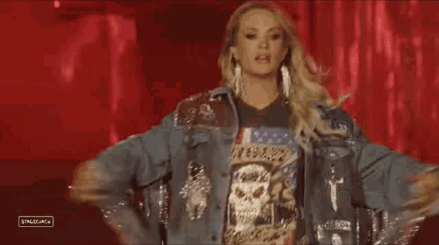 a woman wearing a denim jacket and a t-shirt that says stagecoach