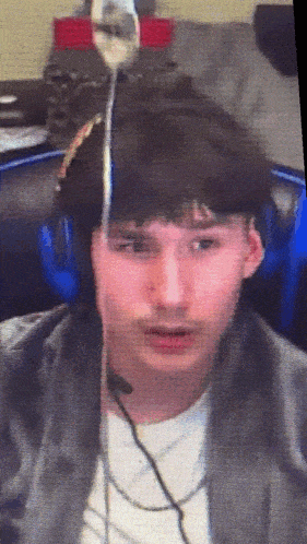 a blurry picture of a man wearing headphones and a microphone