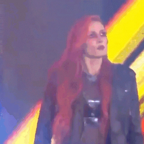 a woman with red hair is wearing sunglasses and a black leather jacket