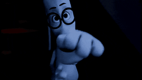 a black and white photo of a cartoon character pointing at the camera .