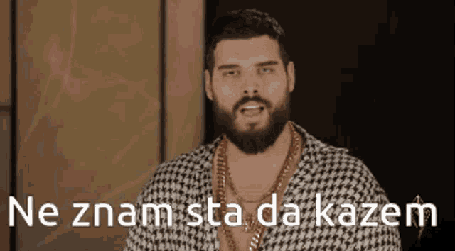 a man with a beard is wearing a gold chain around his neck and has the words ne znam sta da kazem below him