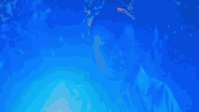 a person with a bandana on their head is walking in the dark .