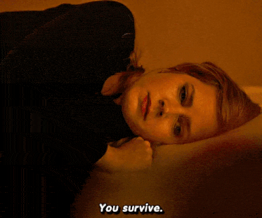 a woman laying on a bed with the words " you survive " below her